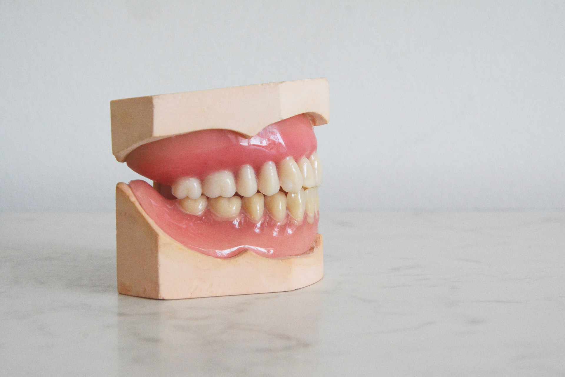 set of new dentures sitting on countertop