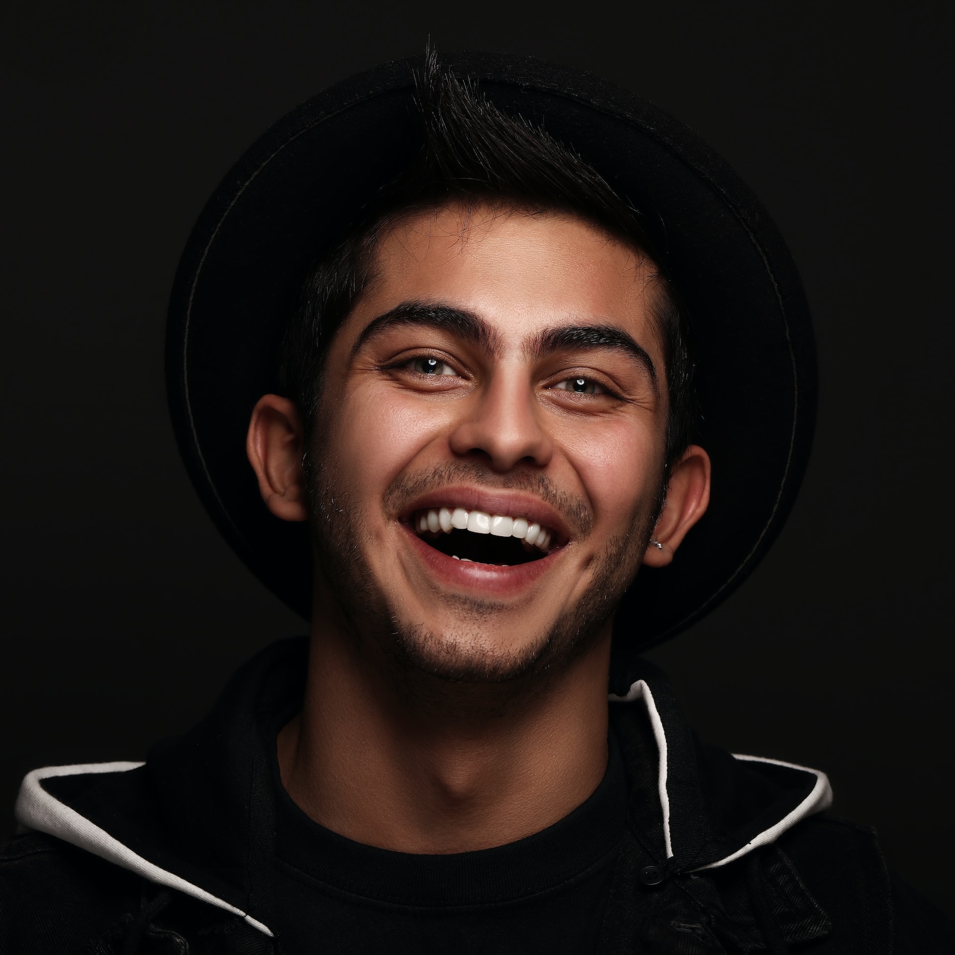 portrait of man smiling at the camera after teeth whitening