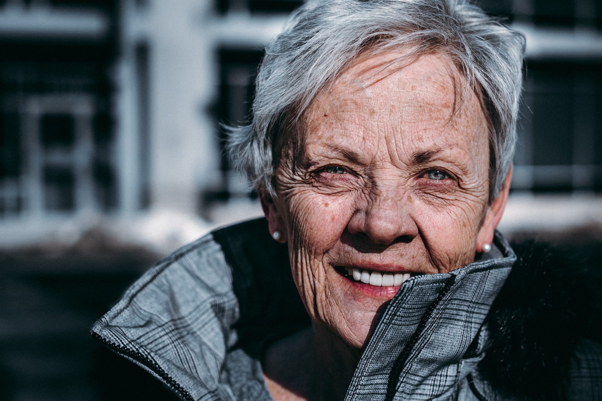 portrait of older woman wearing dentures