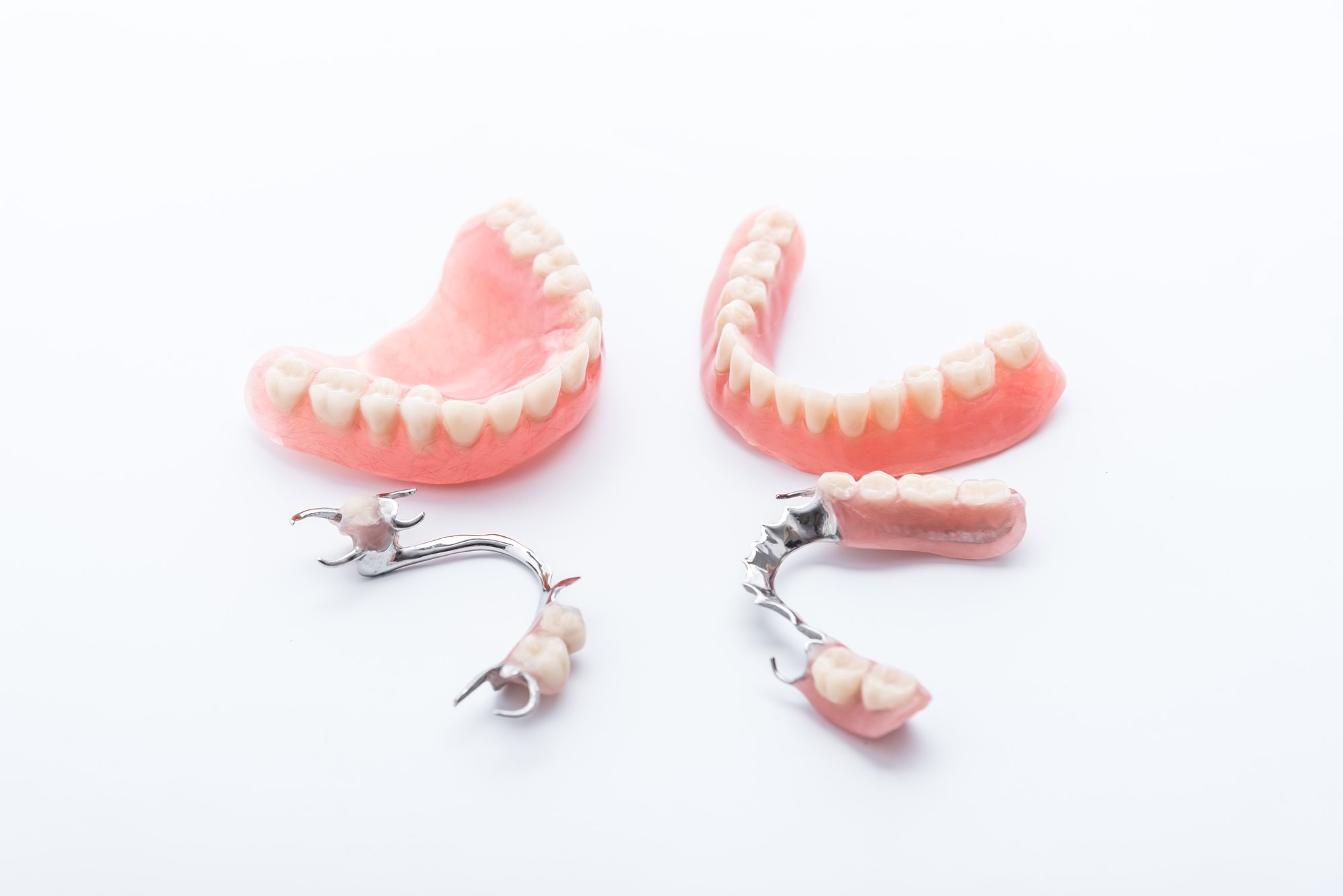Set of partial dentures on white background