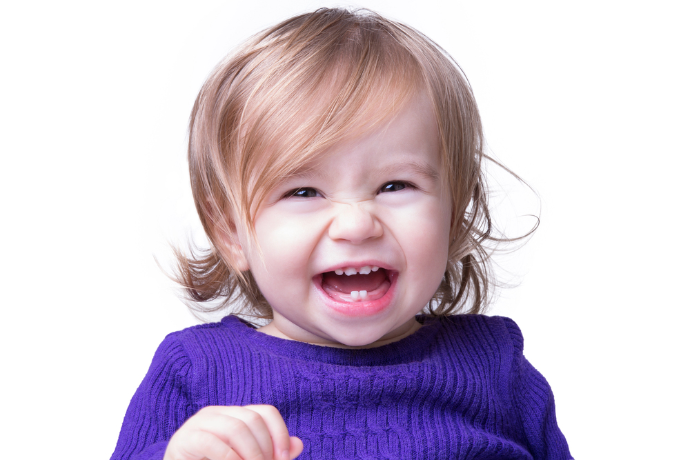 portrait of happy little girl on white background