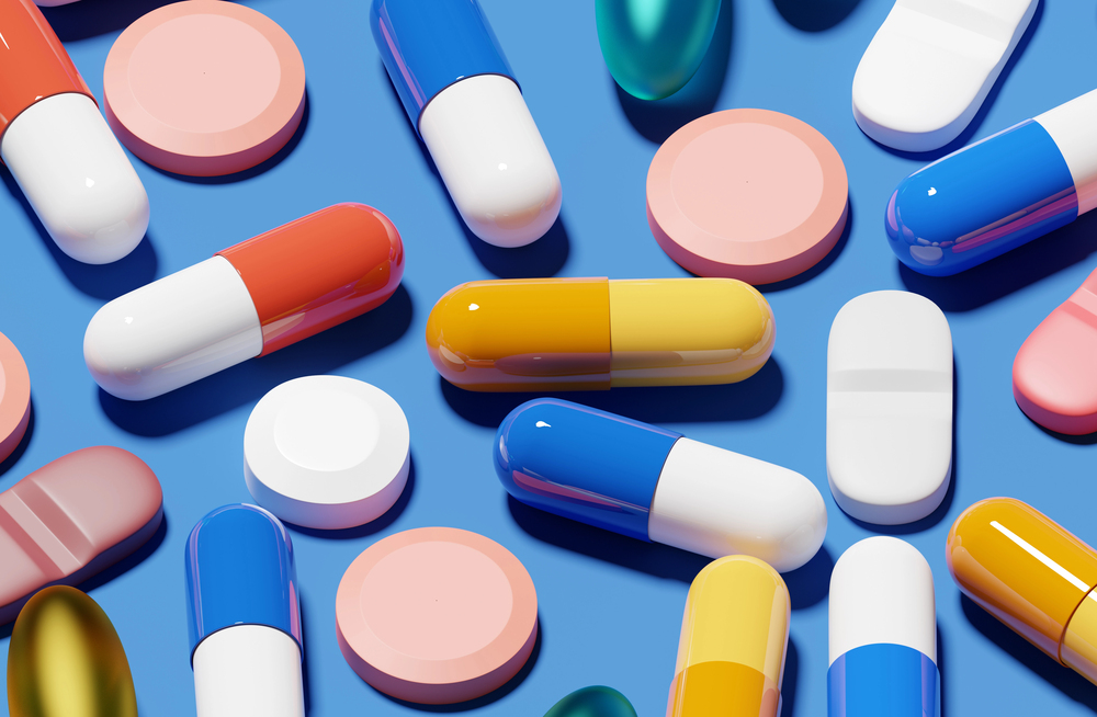 pills laid out on blue table